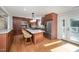 Spacious kitchen featuring granite counters, stainless appliances, and a large island with seating at 2800 Glen Burnie Dr, Raleigh, NC 27607