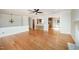 Open-concept living room featuring hardwood floors, fireplace, and a bar area at 2800 Glen Burnie Dr, Raleigh, NC 27607