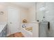 Bathroom features a soaking tub with wood accents and walk-in shower at 2822 Pickett Rd # 173, Durham, NC 27705