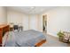Bright bedroom with ceiling fan, and view into home gym or closet at 2822 Pickett Rd # 173, Durham, NC 27705