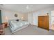 Neutral bedroom with white ceiling fan and doors, and beige walls at 2822 Pickett Rd # 173, Durham, NC 27705