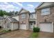 Charming townhouse with stone accents, attached garages, and a welcoming front entrance at 2822 Pickett Rd # 173, Durham, NC 27705