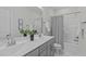 Bathroom featuring a double sink vanity and a shower with a tub at 2924 Watering Hole Way, Apex, NC 27502