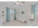 Charming Bedroom with a white crib, polka dot wallpaper, and soothing blue accents at 2924 Watering Hole Way, Apex, NC 27502