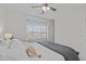 This bedroom features a plush bed with decorative pillows and a view to the street at 2924 Watering Hole Way, Apex, NC 27502