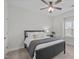 This bedroom features a ceiling fan, plush carpet, and a large window for natural light at 2924 Watering Hole Way, Apex, NC 27502