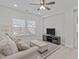 Cozy bonus room featuring carpet floors, a TV and a sofa at 2924 Watering Hole Way, Apex, NC 27502