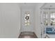 Welcoming foyer with a front door, decorative wreath, and a view into the living room at 2924 Watering Hole Way, Apex, NC 27502