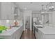 Gourmet kitchen with stainless steel appliances, quartz counters, and a view of the butler's pantry at 2924 Watering Hole Way, Apex, NC 27502