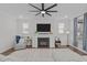 Comfortable living room featuring a cozy fireplace and neutral decor at 2924 Watering Hole Way, Apex, NC 27502