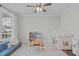 Cozy playroom featuring a book shelf, toy tea set, play kitchen, and play tent with string lights at 2924 Watering Hole Way, Apex, NC 27502
