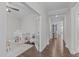 Bright playroom featuring hardwood floors and a play tent, flowing into the living area at 2924 Watering Hole Way, Apex, NC 27502