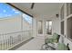 Enjoy the screened-in porch with cozy seating, ceiling fan, and a view of the backyard at 2924 Watering Hole Way, Apex, NC 27502
