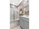 Neutral bathroom featuring a glass enclosed shower, grey vanity and stylish decorative accents at 306 Crossland Dr, Chapel Hill, NC 27517