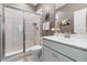 Modern bathroom with a glass shower, white vanity, sleek fixtures, and neutral tones at 306 Crossland Dr, Chapel Hill, NC 27517