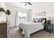 Cozy bedroom featuring a comfortable bed, neutral tones, and a ceiling fan at 306 Crossland Dr, Chapel Hill, NC 27517