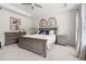 Main Bedroom with neutral carpet, tray ceiling, lamps and wooden furniture set at 306 Crossland Dr, Chapel Hill, NC 27517
