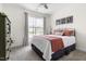 Cozy bedroom with a large window, comfortable bed, neutral tones, and natural light at 306 Crossland Dr, Chapel Hill, NC 27517