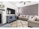 Comfortable living room with a decorative fireplace, modern TV, and stylish furnishings on plank flooring at 306 Crossland Dr, Chapel Hill, NC 27517