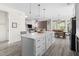 Bright open-concept living space featuring a kitchen island, dining area, and cozy living room at 306 Crossland Dr, Chapel Hill, NC 27517