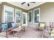 Relaxing porch with wicker seating, a ceiling fan, and abundant natural light at 306 Crossland Dr, Chapel Hill, NC 27517