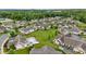 Aerial view of a neighborhood, showcasing landscaping and a pool at 306 Faith Dr, Gibsonville, NC 27249