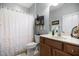 Bathroom featuring a vanity with a sink, toilet, and a shower with curtain at 306 Faith Dr, Gibsonville, NC 27249