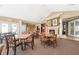 Inviting clubhouse area with tables, fireplace, and kitchenette, creating a cozy atmosphere for residents at 306 Faith Dr, Gibsonville, NC 27249
