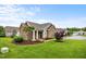 Charming single-story home with stone accents, a well-manicured lawn, and inviting curb appeal at 306 Faith Dr, Gibsonville, NC 27249
