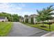 A peaceful community street view, with perfectly manicured lawns and beautiful landscaping at 306 Faith Dr, Gibsonville, NC 27249