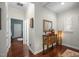 Foyer with wood floors, decorative table with lamp, and mirror creating an inviting entrance at 306 Faith Dr, Gibsonville, NC 27249