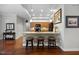 Charming kitchen with dark hardwood flooring, updated cabinetry, and island bar seating at 306 Faith Dr, Gibsonville, NC 27249