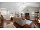 Spacious living room featuring a vaulted ceiling, hardwood flooring, and lots of natural light at 306 Faith Dr, Gibsonville, NC 27249