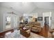 Bright living room with hardwood floors, ceiling fan, comfortable seating, and access to the patio at 306 Faith Dr, Gibsonville, NC 27249