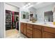 Main bathroom featuring a double vanity and walk-in closet at 306 Faith Dr, Gibsonville, NC 27249