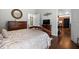 Main bedroom featuring wood furniture, hardwood floors and access to main bathroom at 306 Faith Dr, Gibsonville, NC 27249