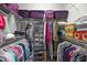 Well-organized walk-in closet with shelving and hanging space for clothing and accessories at 306 Faith Dr, Gibsonville, NC 27249