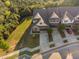 Aerial view of a two story home with an attached two-car garage and driveway plus a front and side yard at 310 Alamosa Pl, Cary, NC 27519