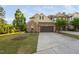 Charming home featuring brick accents, a two-car garage, and mature landscaping at 310 Alamosa Pl, Cary, NC 27519