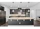 Gourmet kitchen featuring granite countertops, stainless steel appliances, and modern lighting at 310 Alamosa Pl, Cary, NC 27519