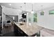 Bright, modern kitchen with granite island, stainless steel appliances, and open floor plan at 310 Alamosa Pl, Cary, NC 27519
