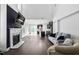 Spacious living room featuring a fireplace, high ceilings, and an open kitchen at 310 Alamosa Pl, Cary, NC 27519
