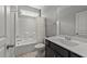 Bathroom featuring a tub/shower combo, modern sink with cabinet, and neutral flooring at 3122 Jones Lake Rd, Fuquay Varina, NC 27526