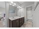 Bright bathroom with a double sink vanity and tub/shower combo at 3122 Jones Lake Rd, Fuquay Varina, NC 27526