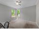 Bright bedroom featuring neutral walls and a window providing ample natural light at 3122 Jones Lake Rd, Fuquay Varina, NC 27526