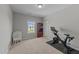Bedroom featuring neutral walls, carpet flooring, and home gym setup at 3122 Jones Lake Rd, Fuquay Varina, NC 27526