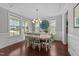 Elegant dining room featuring dark wood floors and natural lighting at 3122 Jones Lake Rd, Fuquay Varina, NC 27526
