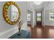 Entryway showcasing hardwood floors and a decorative mirror, offering a welcoming first impression at 3122 Jones Lake Rd, Fuquay Varina, NC 27526