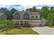 Charming two-story home with a beautifully landscaped front yard and three-car garage at 3122 Jones Lake Rd, Fuquay Varina, NC 27526