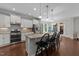 Bright, modern kitchen with white cabinets, granite countertops, and stainless steel appliances at 3122 Jones Lake Rd, Fuquay Varina, NC 27526